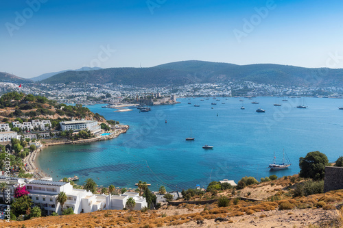 Bodrum skyline with sailboats and luxury yachts in harbor on the Aegean sea in Bodrum, Turkey.