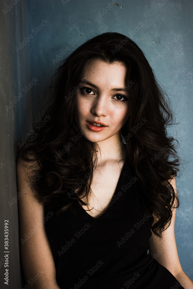 Black hair woman. Beautiful brunette hairstyle fashion portrait over dark background Black hair woman. Beautiful brunette hairstyle fashion portrait over dark background