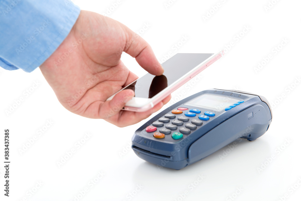 Hand holding mobile phone and scanning payment on pos machine on white background Hand holding mobile phone and scanning payment on pos machine on white background