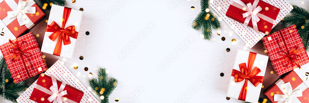 Banner made from festive gift boxes on wooden white background. Banner made from festive gift boxes on wooden white background.