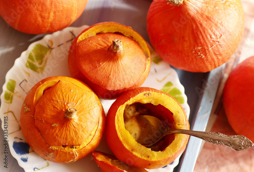 small pumpkin baked and raw still life halloween closeup photo photo