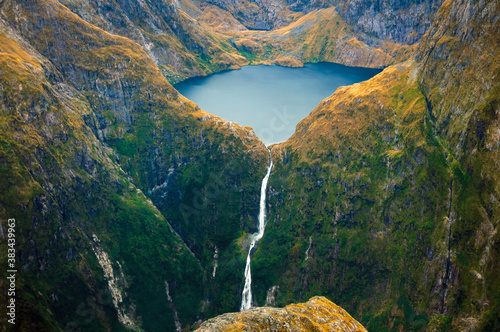Amazing aerial view of mountain Lake Quill and Sutherland Falls on the scenic flight from Milford Sound to Queenstown, Fiordland, New Zealand