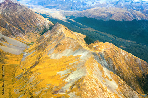 Amazing aerial view of colorful mountain range, on flight between Wanaka and Milford Sound, Fiordland, New Zealand