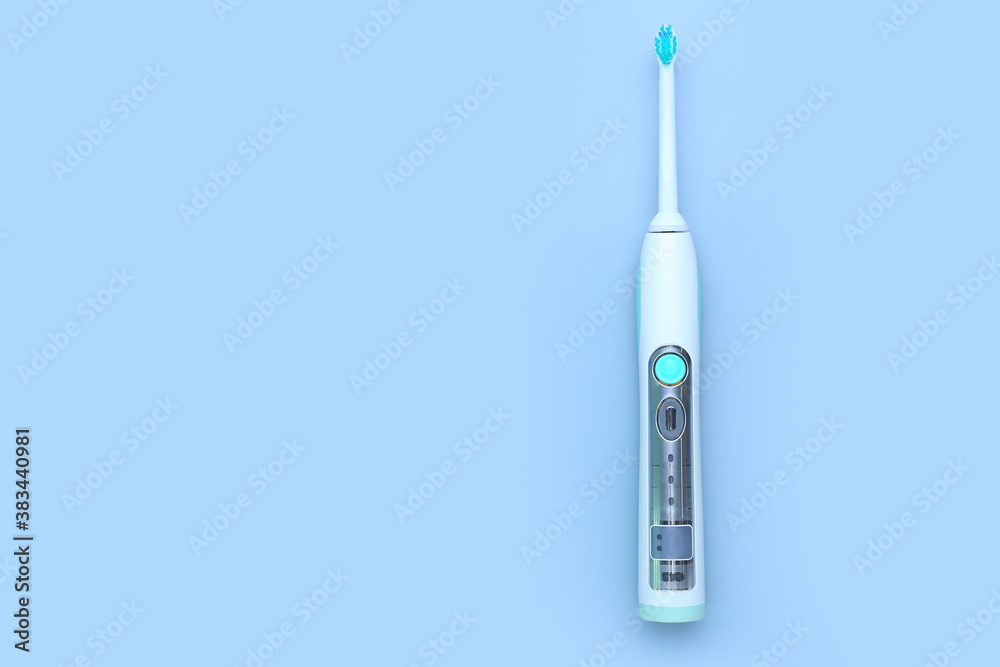 Electric tooth brush on grey background Electric tooth brush on grey background