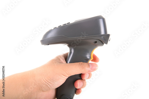 A hand holding a payment scanner in front of a white background