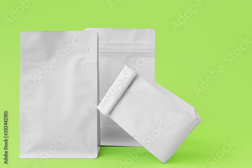 Blank bags on color background © Pixel-Shot