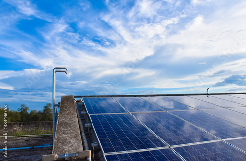 Photovoltaics installed on the roof of the building to use green and clean energy at home or at work. photo