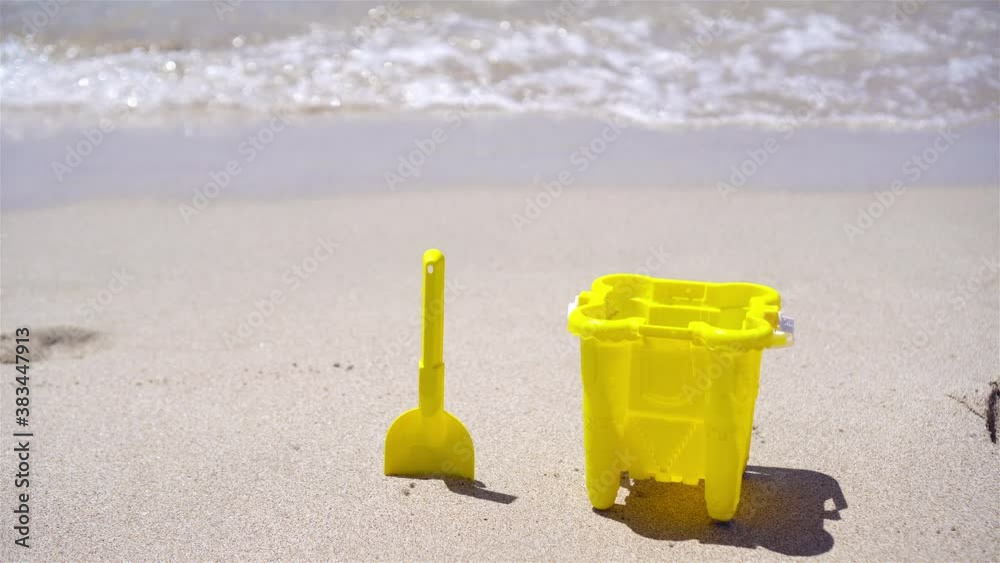 Beach kid's toys on white sand beach Beach kid's toys on white sand beach