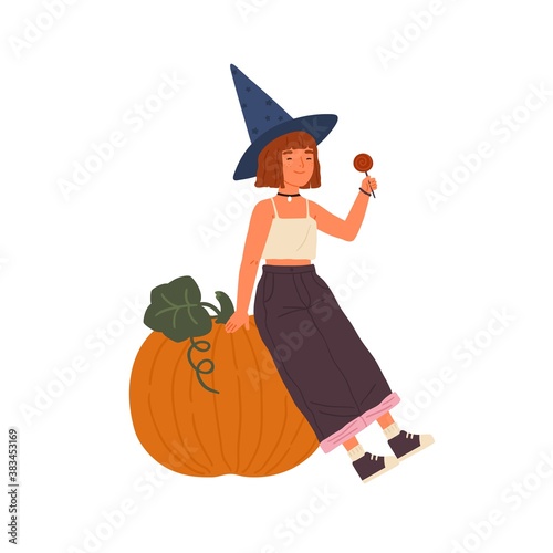 Cute girl wearing witch hat hold lollipop and sit on Halloween pumpkin. Portrait of young sorcerer with red hair. Flat vector cartoon childish illustration of mage isolated on white background