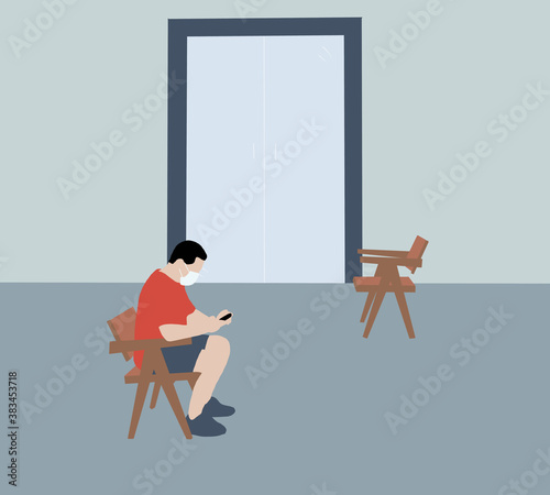 Man queuing for doctor with face mask and using his smart phone in waiting room of a hospital .Covid 19 Virus Prevention And Medical Treatment Concept.