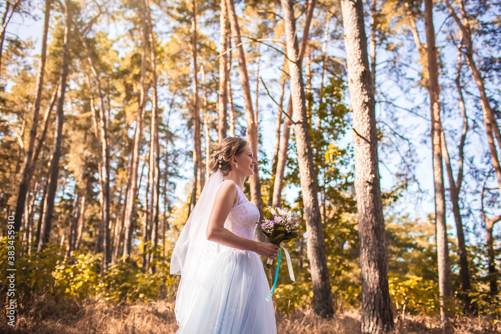 happy bride with a bouquet is walking the green park happy bride with a bouquet is walking the green park