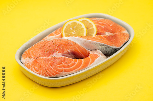 fresh salmon with lemon on dish