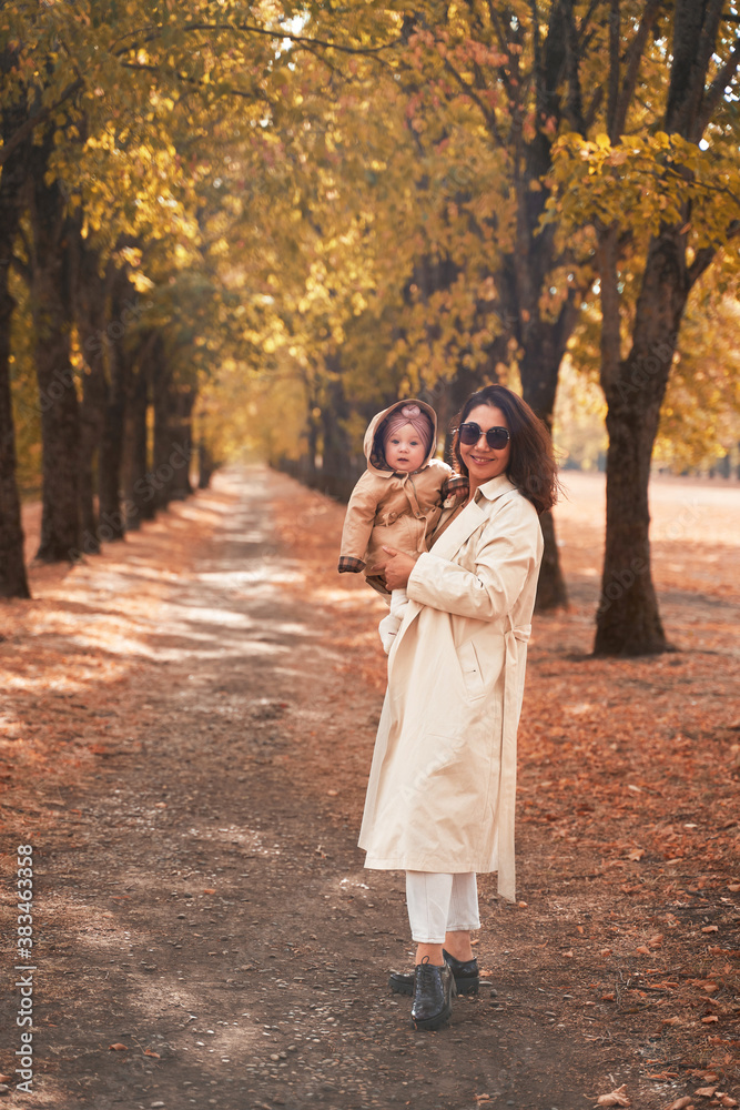 Fototapeta premium mother and little daughter walk in the autumn Park