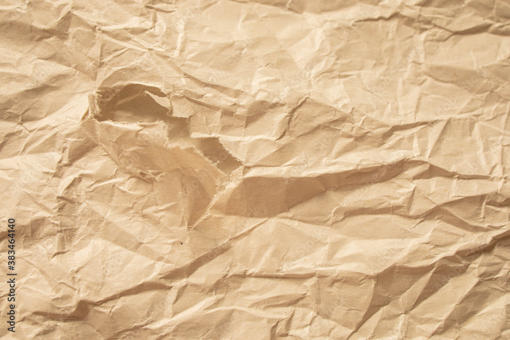 Fototapeta premium Brown crumpled paper close up texture background