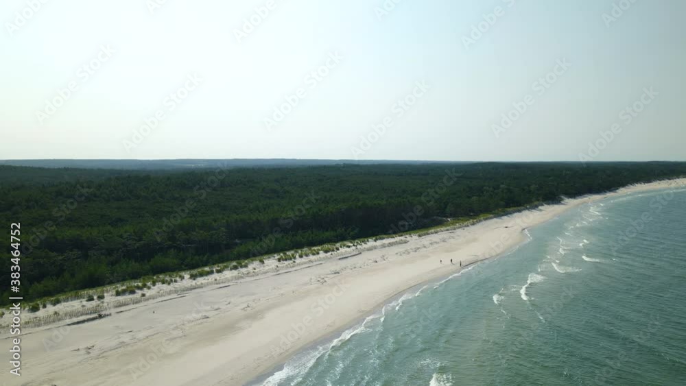 Aerial orbit of beautiful Osetnik beach with forest and waves on sunny summer day Aerial orbit of beautiful Osetnik beach with forest and waves on sunny summer day