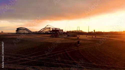 drone footage of beach at sunset.