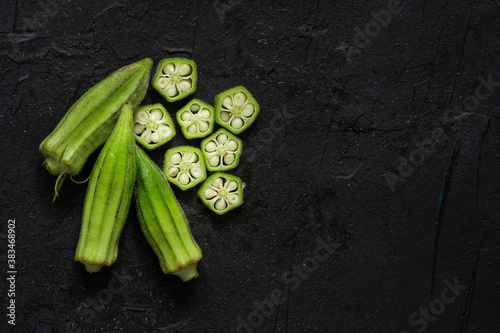 Fresh okra on black background photo