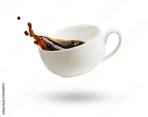 A cup of coffee with splash isolated on a white photo