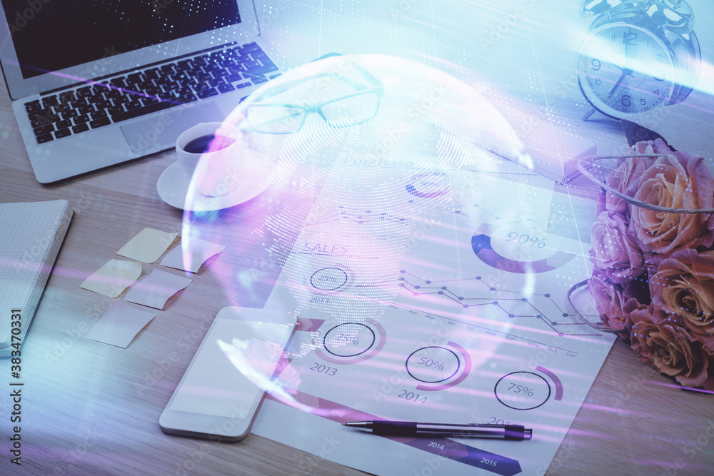Computer on desktop in office with technology theme hologram. Double exposure. Tech concept. Computer on desktop in office with technology theme hologram. Double exposure. Tech concept.