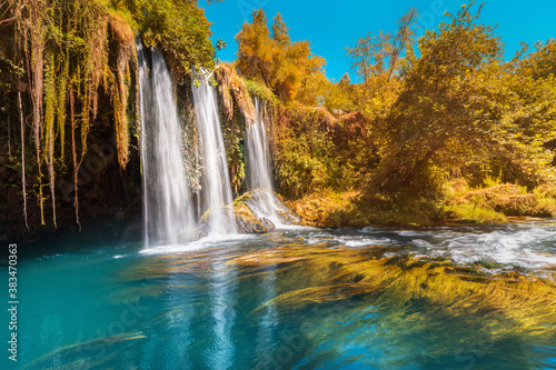 Fototapeta Naklejka Na Ścianę i Meble -  The upper Dyuden waterfall is a unique natural wonder not far from the center of Antalya. Golden soft light in early autumn in Turkey