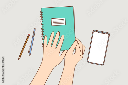 Education, study, lesson, learning concept. Man or woman student pupil cartoon hands holding opening exercise book at school table in classroom. Getting knowledge or making business diary illustration