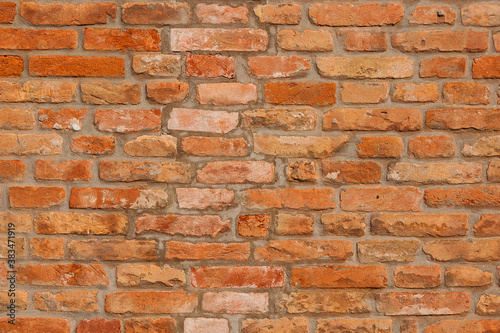 Orange and red brick wall as background