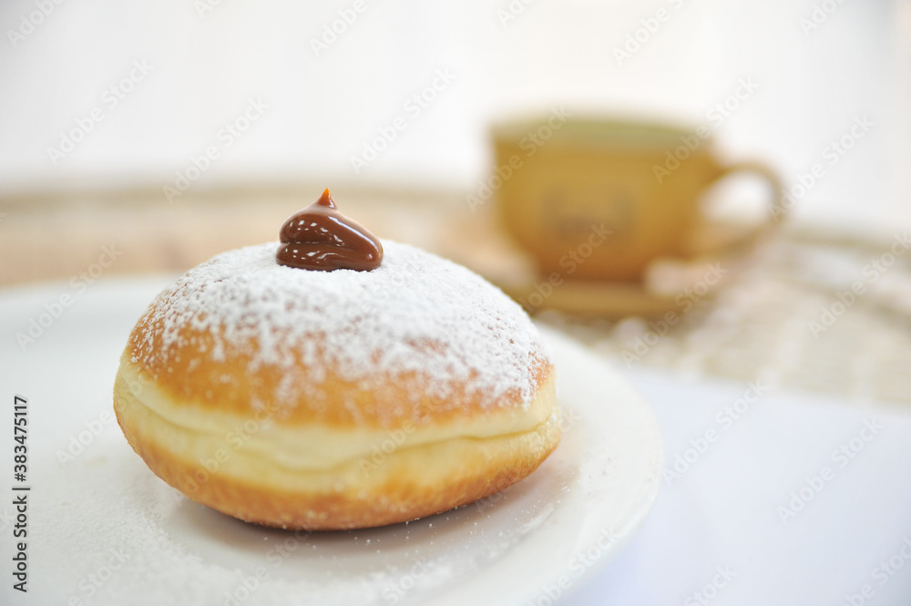 Hanukkah symbol jewish food holiday image of donut with caramel, sugar powder and cup cafe.