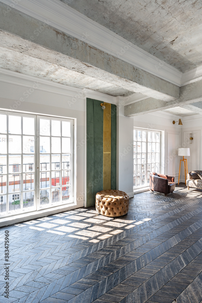 Fototapeta premium Chic, luxurious guest room design with old-fashioned antique furniture. white walls are decorated with relief. there is a beautiful dark brown parquet on the floor.