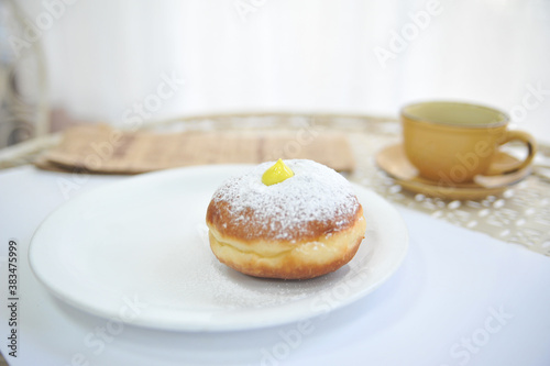 Hanukkah symbol jewish food holiday image of donut with egg jelly and sugar powder.