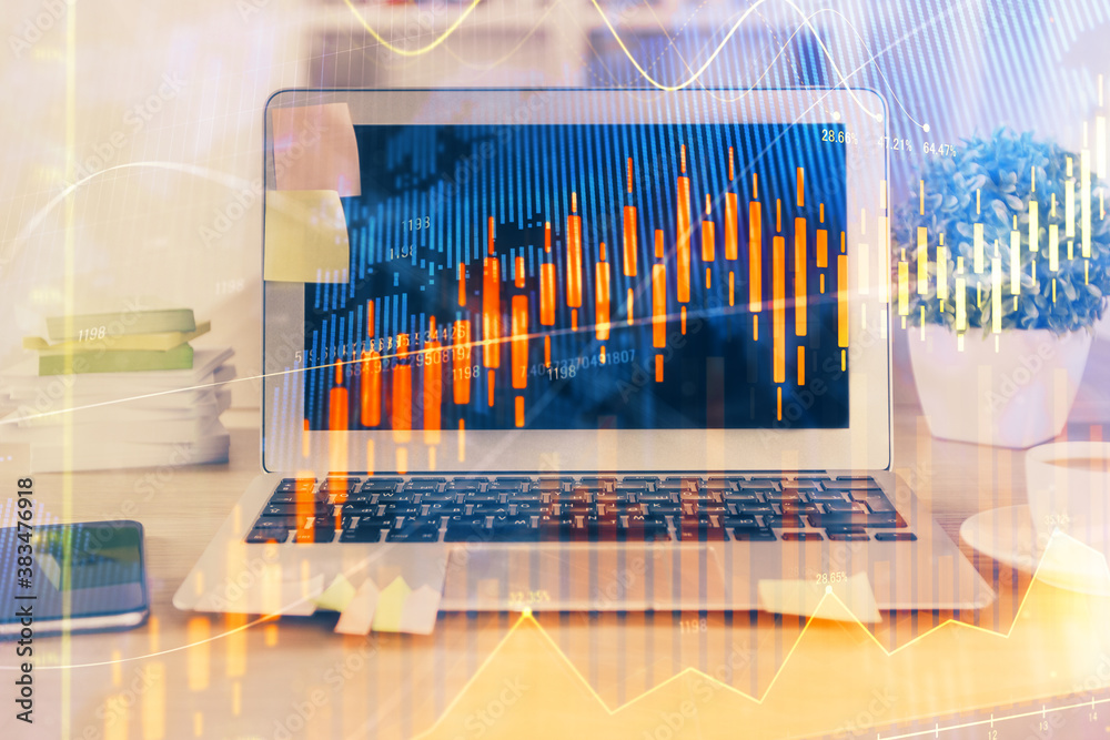 Double exposure of chart and financial info and work space with computer background. Concept of international online trading. Double exposure of chart and financial info and work space with computer background. Concept of international online trading.