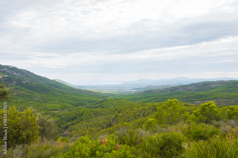 Serra d'Irta natural park, Alcossebre, Costa del Azahar, Spain. Beautiful protected area, contrasted by mountains and clouds. Located between Alcossebre and Peniscola, near the Mediterranean sea. 