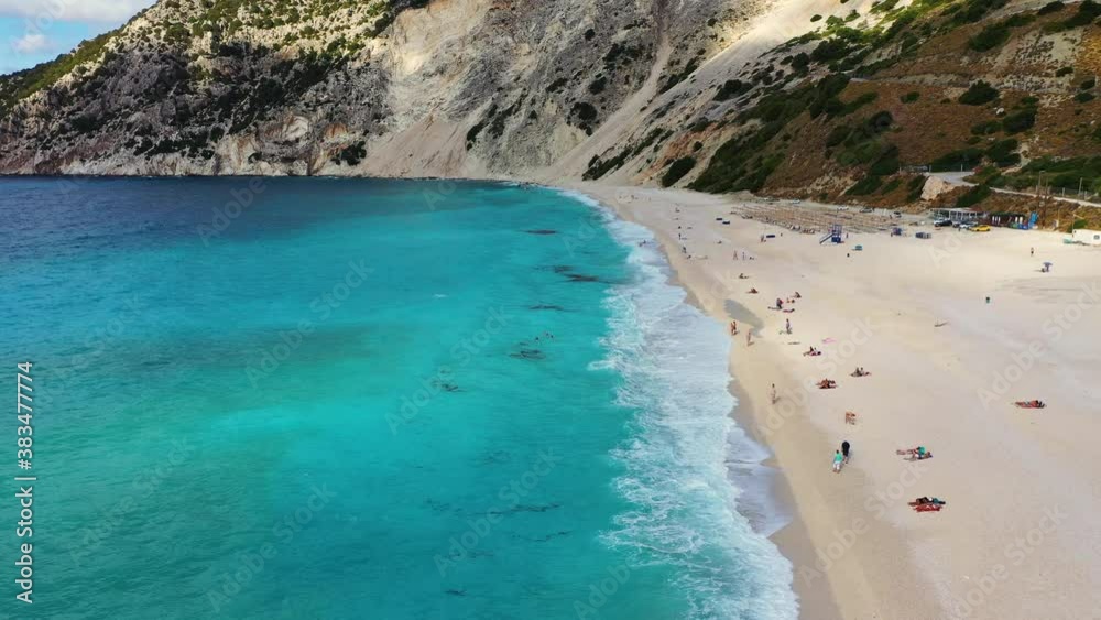 Aerial drone video of iconic turquoise and sapphire bay and beach of Myrtos, Kefalonia (Cephalonia) island, Ionian, Greece. Myrtos beach, Kefalonia island, Greece. Beautiful view of Myrtos beach. Aerial drone video of iconic turquoise and sapphire bay and beach of Myrtos, Kefalonia (Cephalonia) island, Ionian, Greece. Myrtos beach, Kefalonia island, Greece. Beautiful view of Myrtos beach.