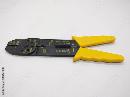 Wire Stripper with black and yellow  handle on a white background photo