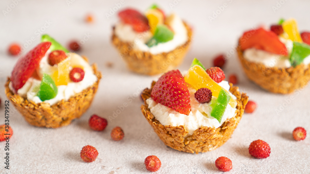 Healthy food and diet concept. Oatmeal backed cups with yogurt and berries. Weekend breakfast. Delicious food at home Healthy food and diet concept. Oatmeal backed cups with yogurt and berries. Weekend breakfast. Delicious food at home