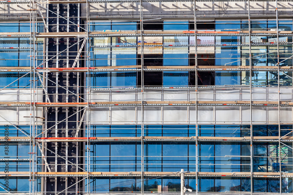 Scaffolding and installation of glass facade panels