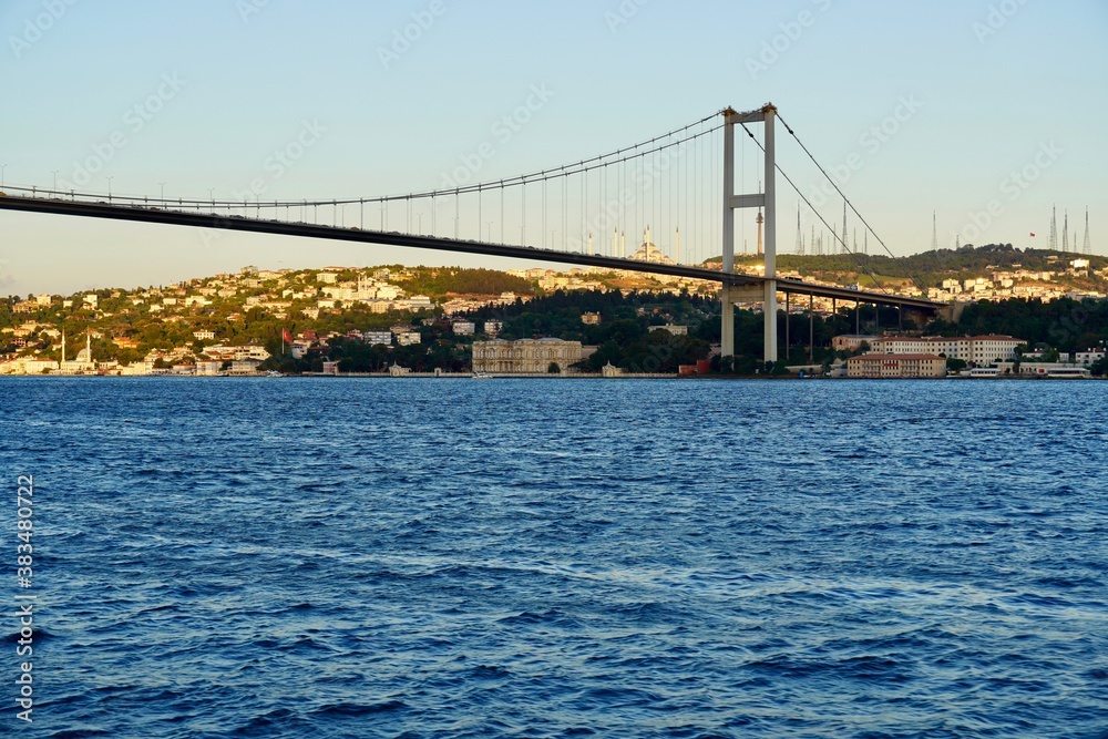 Tourist boats sail under the bridge in Istanbul. Traveling on the Bosphorus. Panoramic view, View of the First Bosphorus Bridge sailling Bosporus. Tourist boats sail under the bridge in Istanbul. Traveling on the Bosphorus. Panoramic view, View of the First Bosphorus Bridge sailling Bosporus.