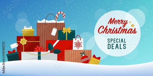 Load of Christmas gifts and shopping bags under the snow