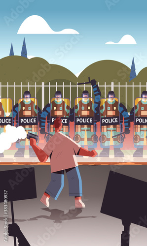policemen in full tactical gear riot police officers controlling street protesters with placards during clashes demonstration protest riots mass concept vertical vector illustration
