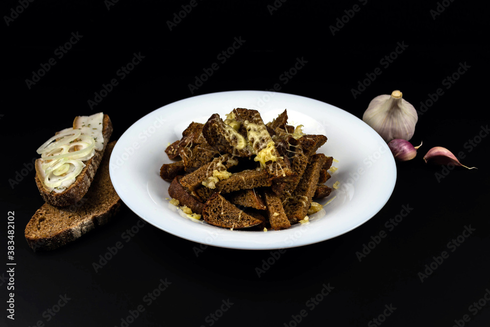 Homemade black bread croutons with garlic and cheese Homemade black bread croutons with garlic and cheese