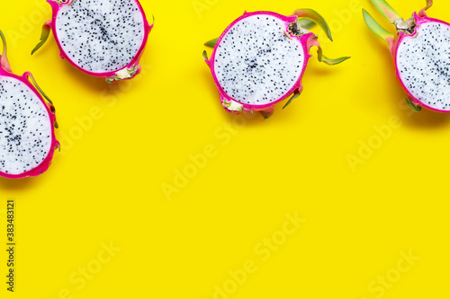 Dragon fruit or pitaya on yellow background.