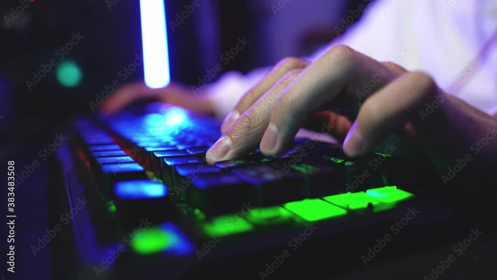 Male hands of a young gamer playing an online game Male hands of a young gamer playing an online game