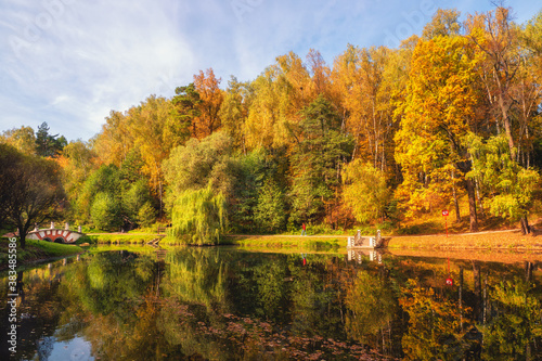 Autumn Park. Beautiful autumn landscape with red trees by the lake. Tsaritsyno, Moscow