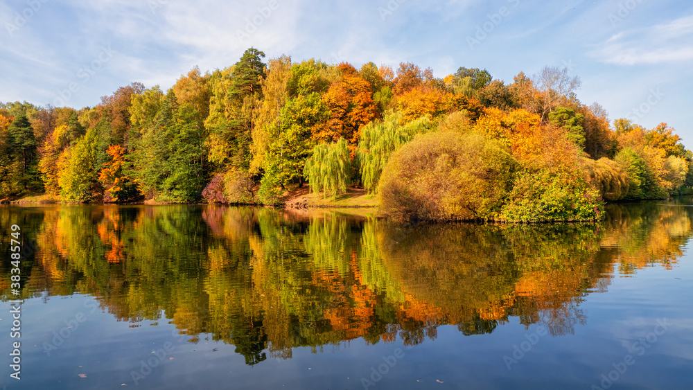 Panorama of the autumn Park. Beautiful autumn landscape with red trees by the lake. Tsaritsyno, Moscow
