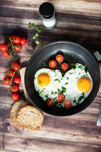 
Fried eggs in a frying pan.