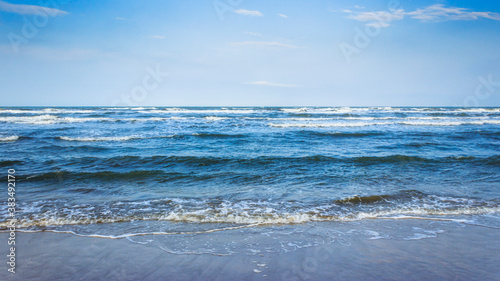 Sandy beach of the Adriatic Sea in calm, clear weather. Rimini, Italy