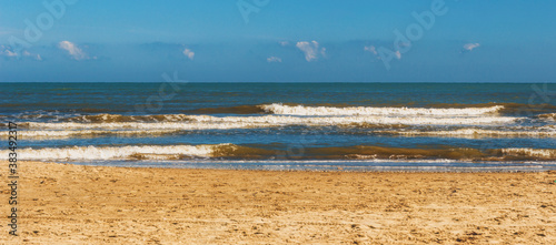 Fototapeta Naklejka Na Ścianę i Meble -  Sandy beach of the Adriatic Sea in calm, clear weather. Rimini, Italy