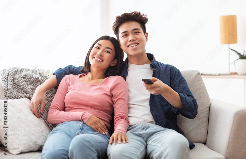 Asian Family Couple Watching Movies On TV Relaxing At Home Asian Family Couple Watching Movies On TV Relaxing At Home