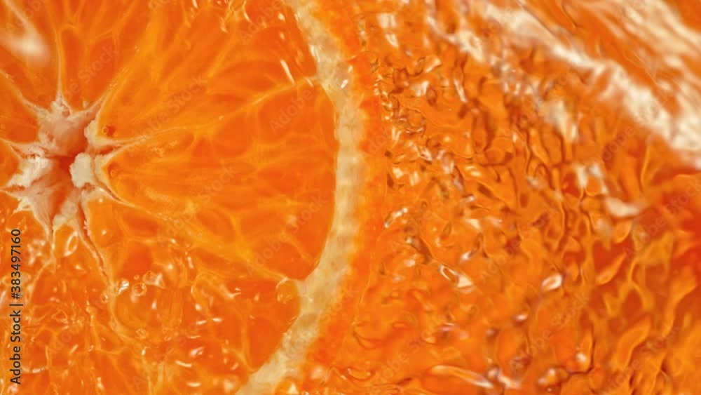 Super Slow Motion Shot of Splashing Water from Rotating Tangerine Slice at 1000fps. Super Slow Motion Shot of Splashing Water from Rotating Tangerine Slice at 1000fps.