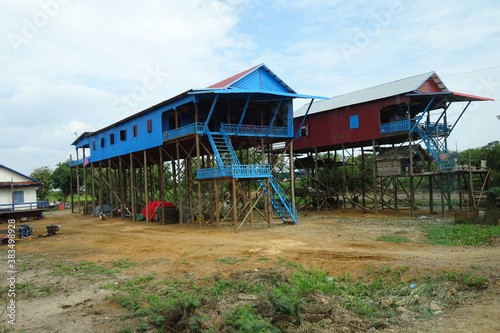 Colorful houses on stilts in floating village Kampong Phluk in Cambodia