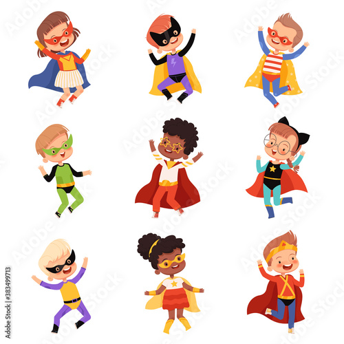 Set with cute kids superheroes. Joyful guys in superhero costumes jump and laugh